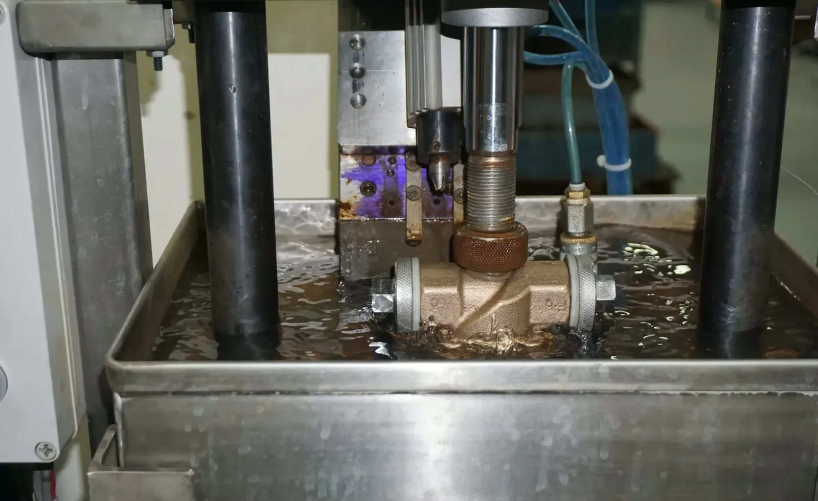 Cast brass valve body under hydrostatic pressure in a test bath